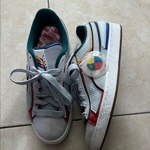 Puma Women's Sneakers with Red, Blue, and Yellow Accents